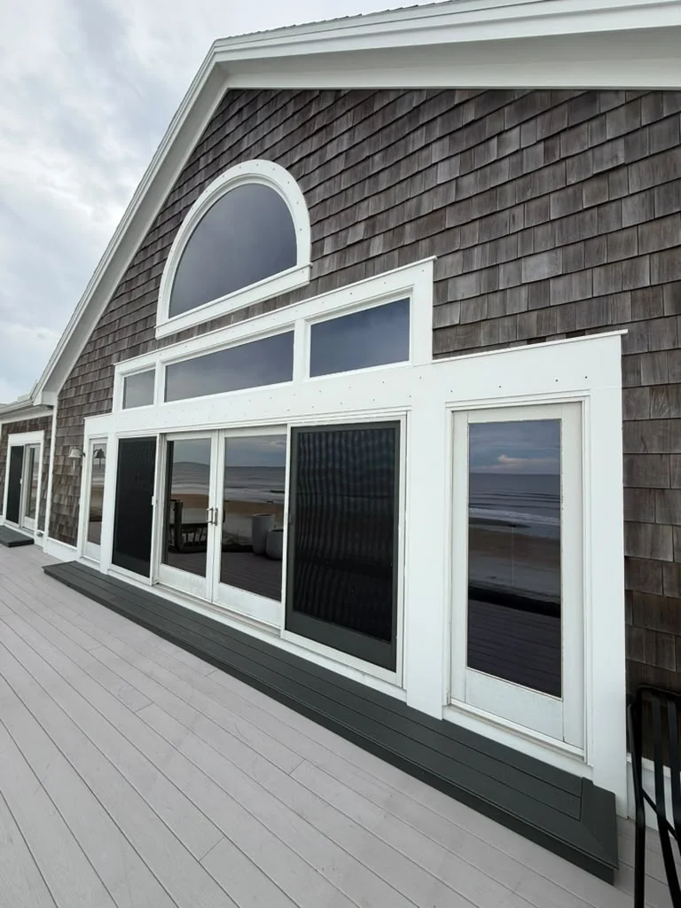 Black Crown Tint project: large residential windows viewed from the deck